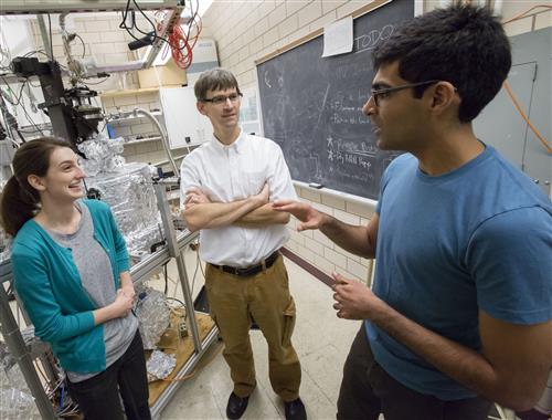 U of I Professor of Physics Peter Abbamonte (center) works with graduate students Anshul Kogar (right) and Mindy Rak (left) in his laboratory at the Frederick Seitz Materials Research Laboratory. Photo by L. Brian Stauffer, University of Illinois at Urbana-Champaign