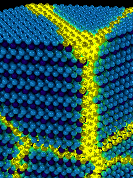 Artist's depiction of the collective excitons of an excitonic solid. These excitations can be thought of as propagating domain walls (yellow) in an otherwise ordered solid exciton background (blue). Image courtesy of Peter Abbamonte, U. of I. Department of Physics and Frederick Seitz Materials Research Laboratory
