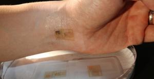 An ultrathin electronic patch with the mechanics of skin applied to the wrist.