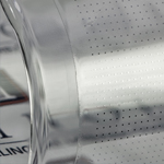 Array of micro-LEDs printed on a curved sheet of plastic.