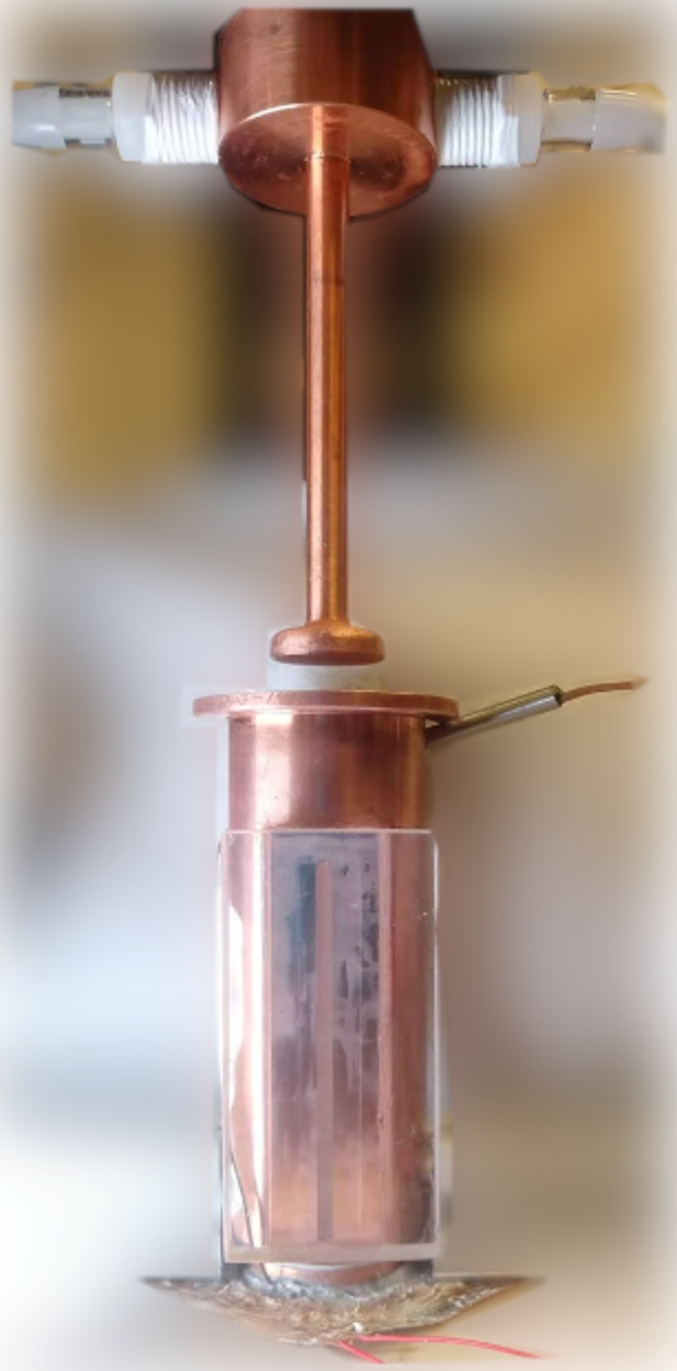 Experimental apparatus showing the piston used to apply pressure to the PCM within the container; the heat source (heating pads) is at the bottom.